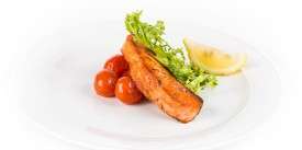 Fried Salmon on a Bed of Baked Tomatoes