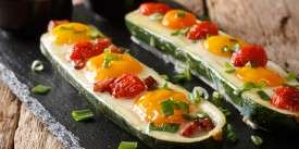 Zucchini Stuffed with Fried Eggs, Chicken and Tomato